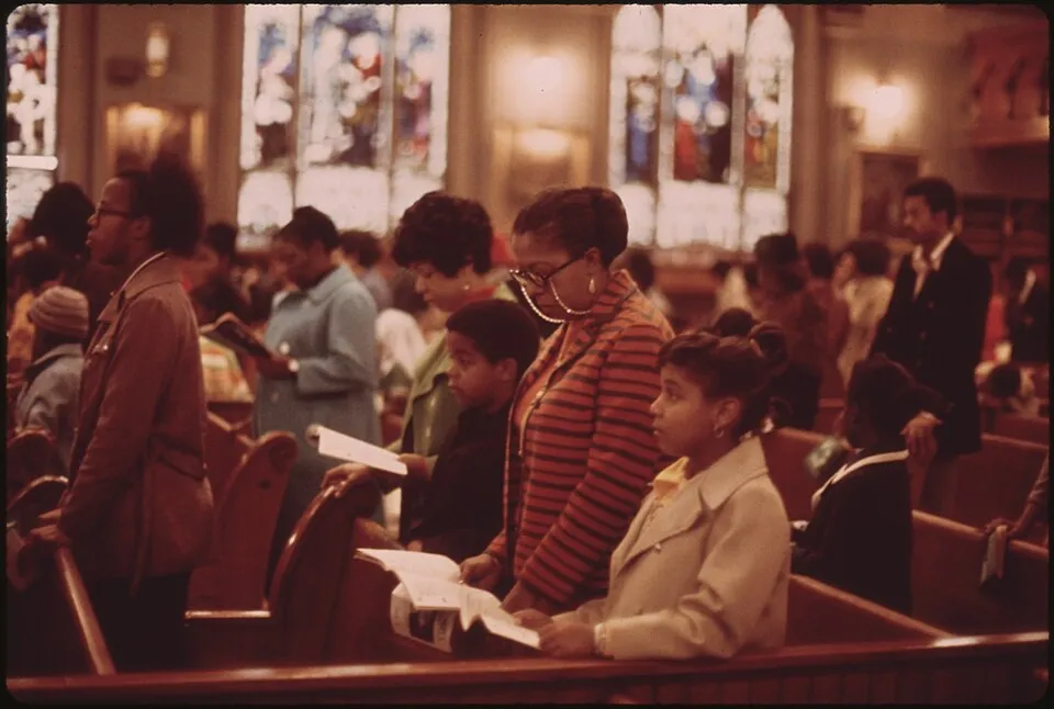 Black families and elders gathered in worship at a historic church