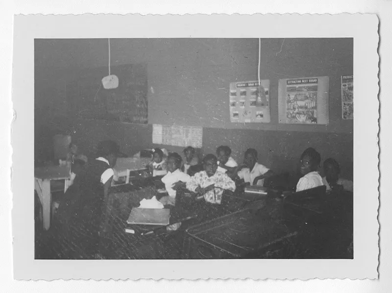 African American students learning together in a 1953 Georgia classroom